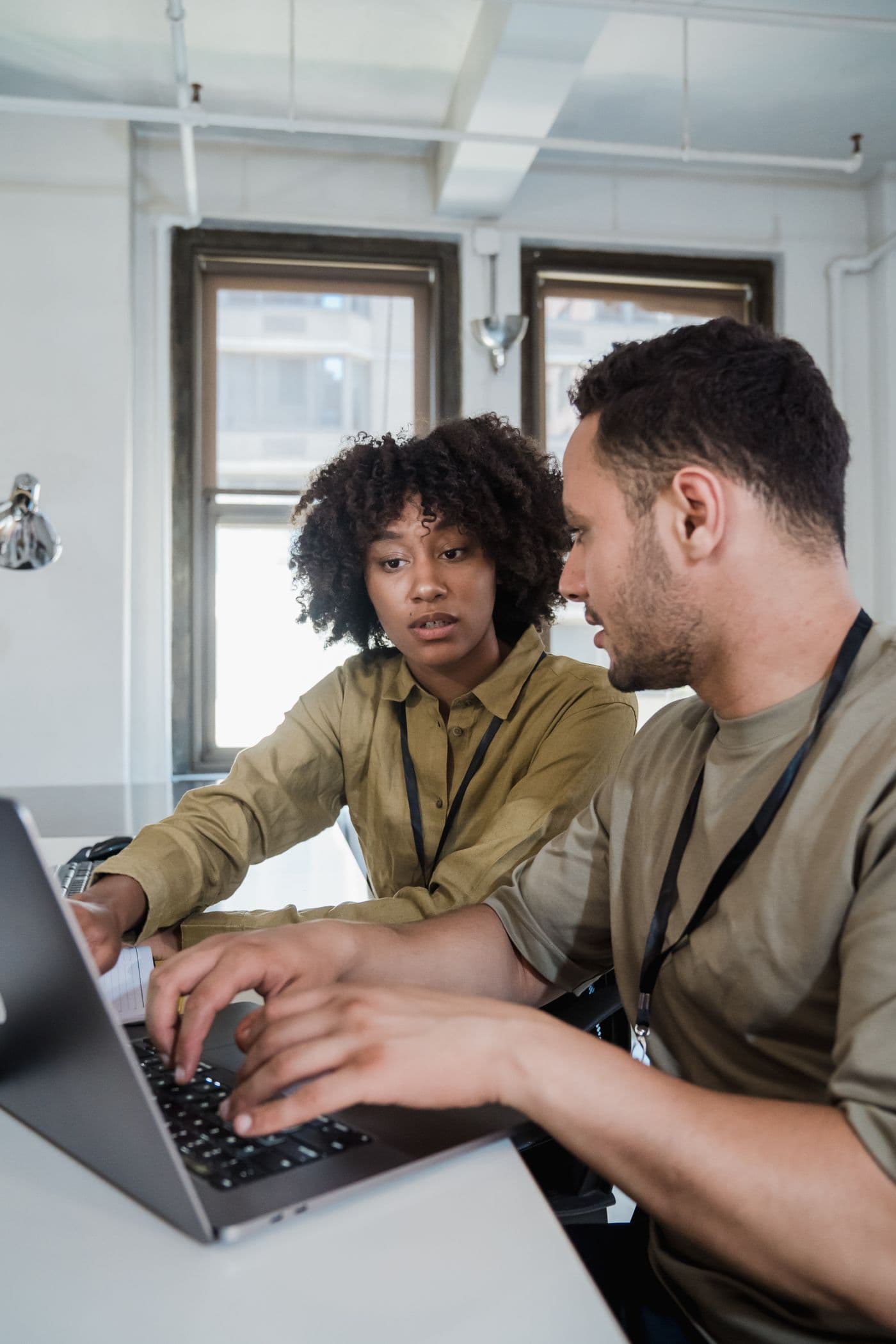 A small team working together around a laptop